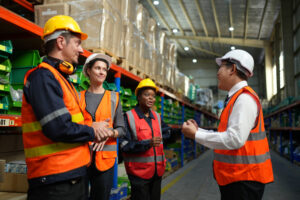Group of light industrial workers having a meeting