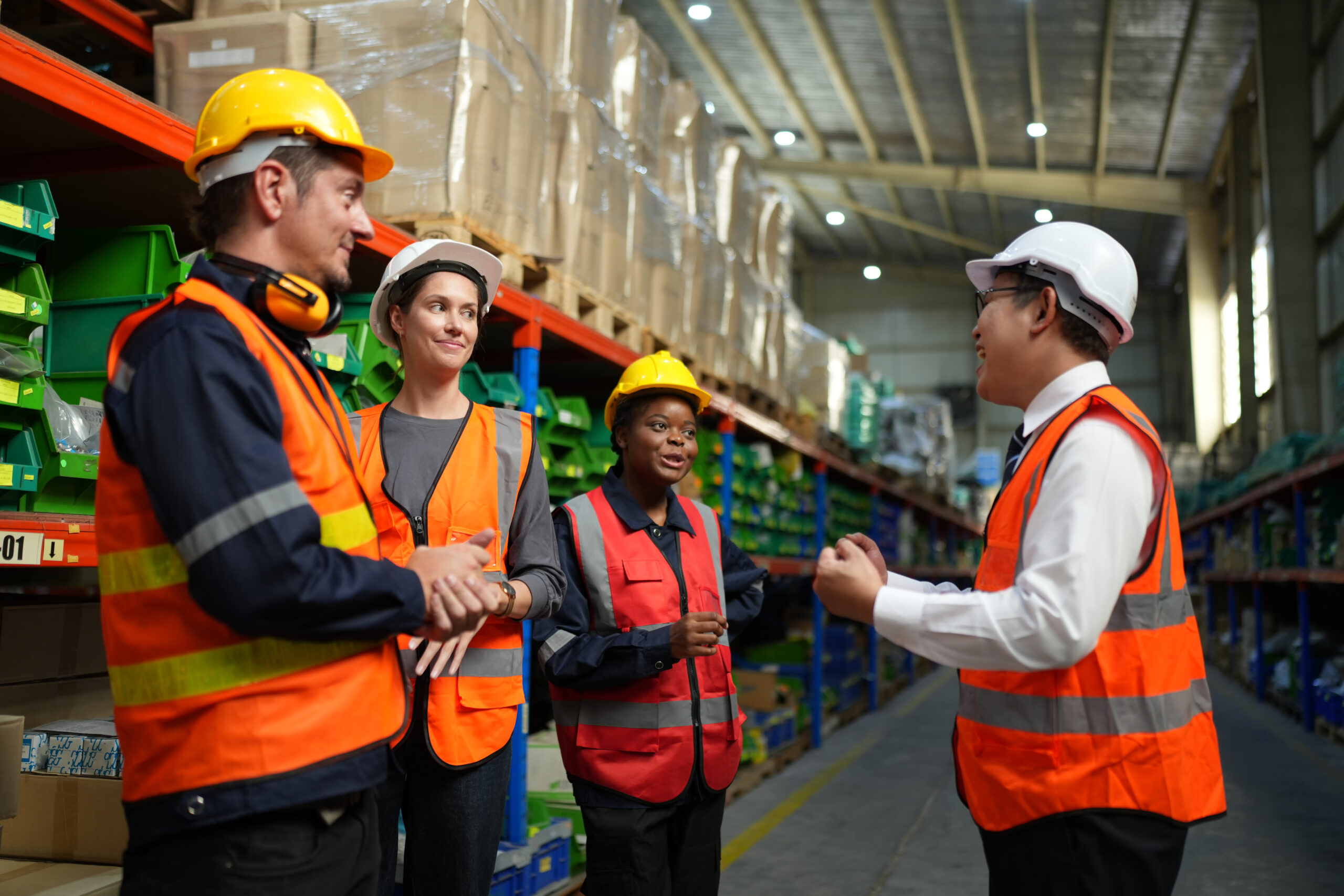 Group of light industrial workers having a meeting